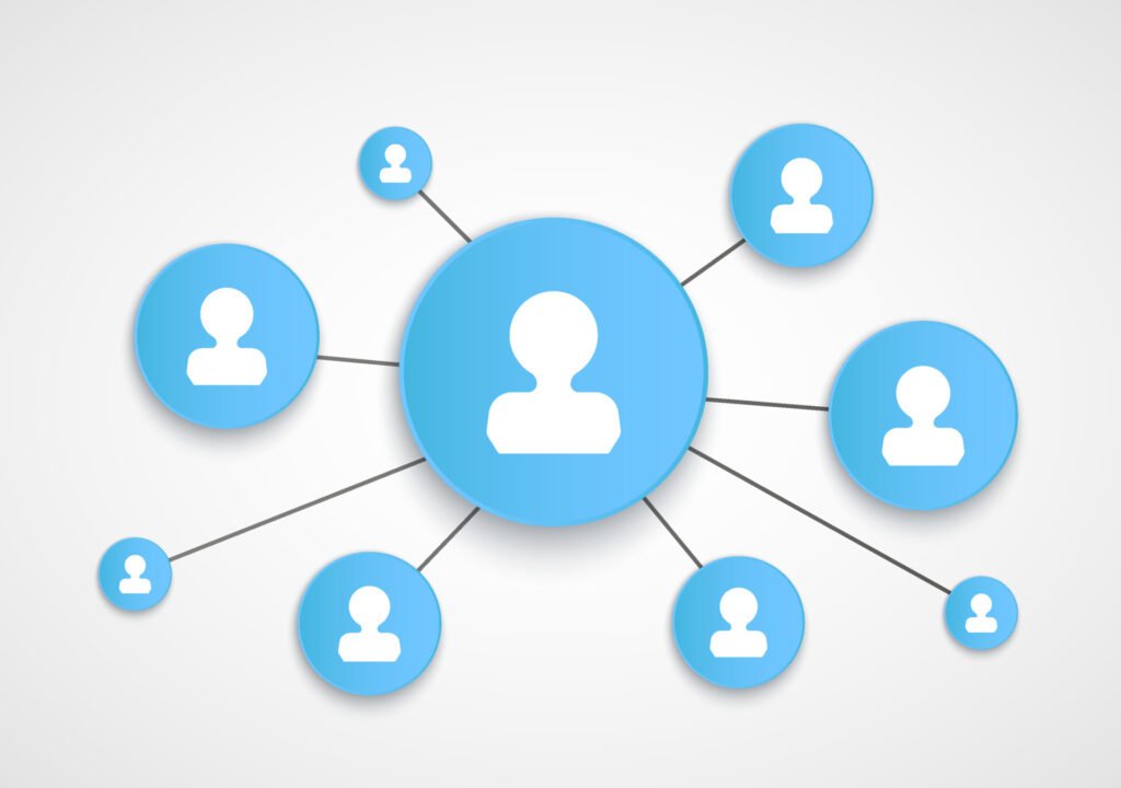 Schematische Darstellung von miteinander verbundenen Personen im Scherenschnitt